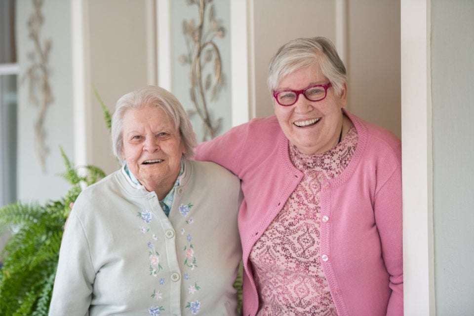 Two residents smiling together